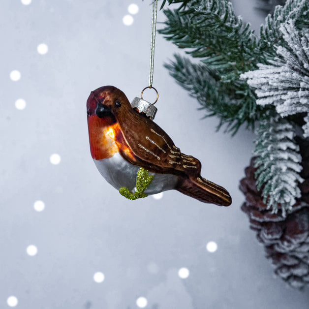 Robin Perching On A Branch Shaped Bauble